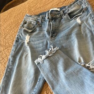 Kancan jean’s distressed front in a light wash color
